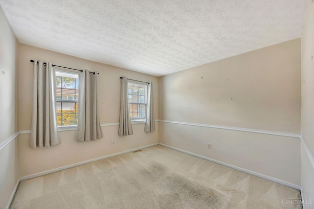 10854 Ponds Ln Unit 8, Sycamore Twp, OH 45242 - spare room featuring plenty of natural light, a textured ceiling, and carpet floors