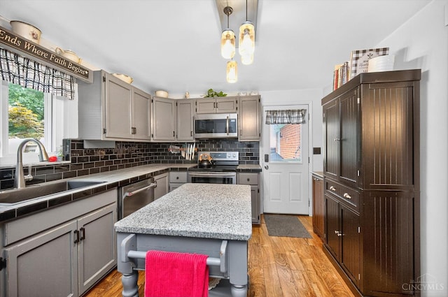 5744 Melody Ln, Milford, OH 45150 - kitchen featuring appliances with stainless steel finishes, healthy amount of natural light, and light wood-type flooring
