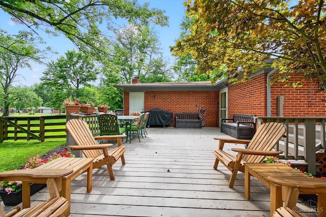 5744 Melody Ln, Milford, OH 45150 - wooden deck with area for grilling and outdoor dining space