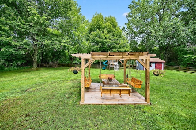 5744 Melody Ln, Milford, OH 45150 - fenced backyard with a playground, a deck, and an outdoor structure