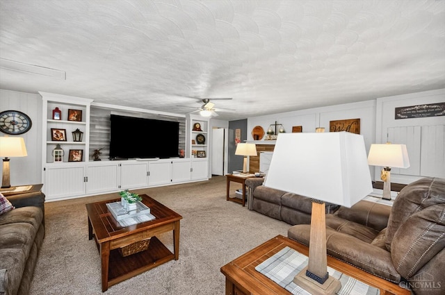 5744 Melody Ln, Milford, OH 45150 - living area featuring a ceiling fan, carpet, and built in shelves