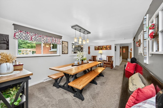 5744 Melody Ln, Milford, OH 45150 - carpeted dining area featuring plenty of natural light