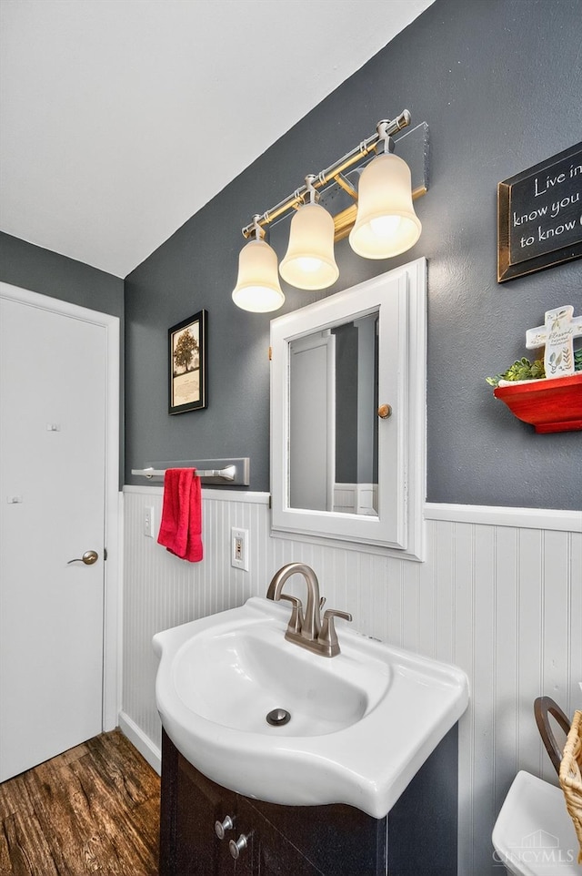5744 Melody Ln, Milford, OH 45150 - bathroom with vanity, a wainscoted wall, and wood finished floors