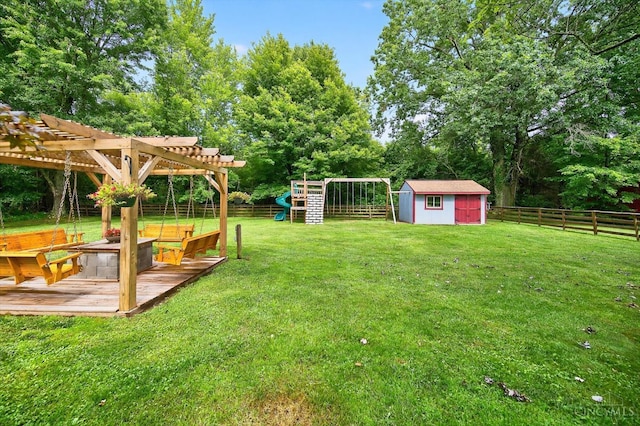 5744 Melody Ln, Milford, OH 45150 - fenced backyard featuring a storage shed, a deck, a playground, view of scattered trees, and a pergola