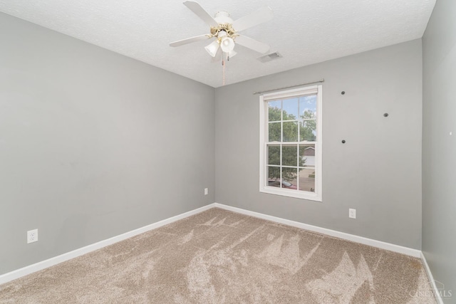 2033 Jackson Ln, Middletown, OH 45044 - spare room featuring carpet flooring, a textured ceiling, and a ceiling fan