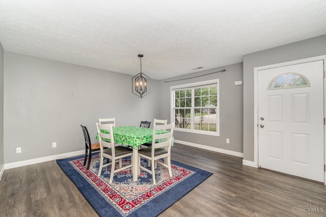 2033 Jackson Ln, Middletown, OH 45044 - dining room with a chandelier, a textured ceiling, and wood finished floors