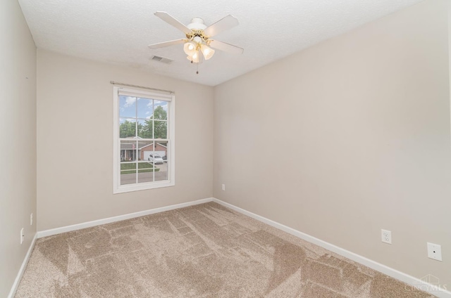 2033 Jackson Ln, Middletown, OH 45044 - spare room with carpet floors, a ceiling fan, and a textured ceiling