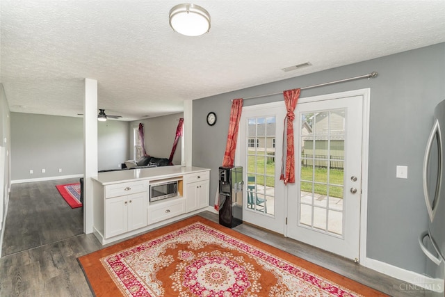 2033 Jackson Ln, Middletown, OH 45044 - foyer featuring a textured ceiling, dark wood finished floors, and a ceiling fan