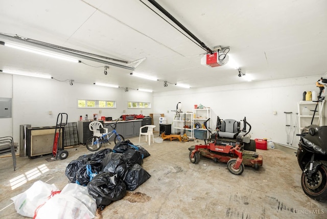 11818 Cloverlick Rd, Bethel, OH 45106 - garage with electric panel and a garage door opener