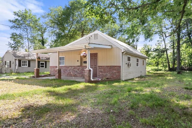 340 N E St, Bethel, OH 45106 - bungalow with brick siding and a front lawn