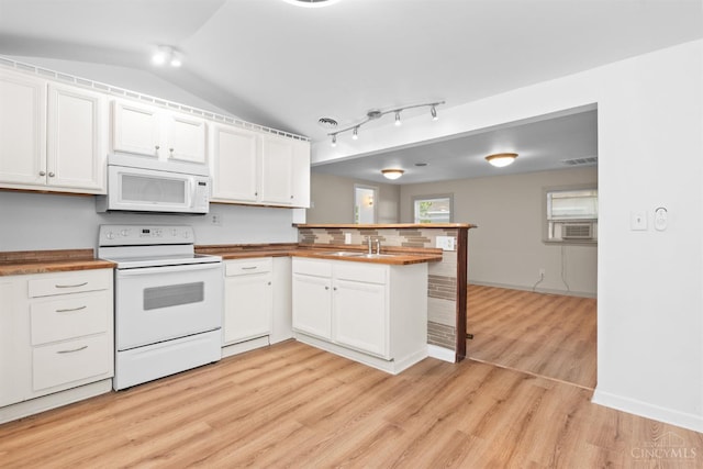 340 N E St, Bethel, OH 45106 - kitchen with white appliances, a peninsula, light wood-type flooring, white cabinets, and a breakfast bar