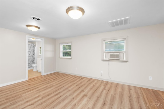 340 N E St, Bethel, OH 45106 - empty room with cooling unit and wood finished floors