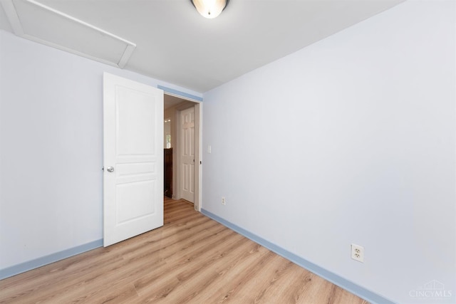 340 N E St, Bethel, OH 45106 - unfurnished room featuring light wood-style flooring and attic access