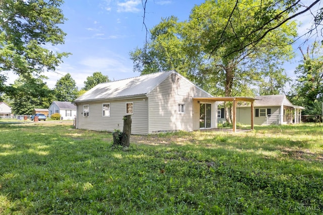 340 N E St, Bethel, OH 45106 - back of house with a lawn and a metal roof
