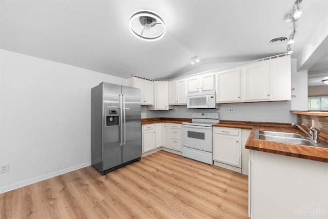 340 N E St, Bethel, OH 45106 - kitchen with white appliances, butcher block countertops, vaulted ceiling, light wood-style floors, and white cabinetry