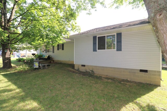 416 N Broadway St, Blanchester, OH 45107 - view of side of property with a yard and crawl space