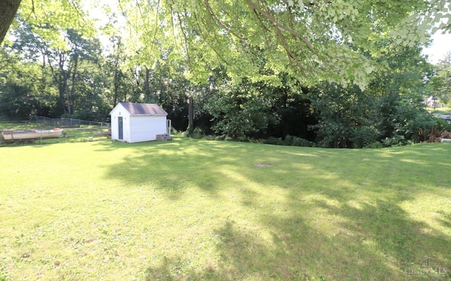 416 N Broadway St, Blanchester, OH 45107 - view of yard with a storage unit and view of scattered trees