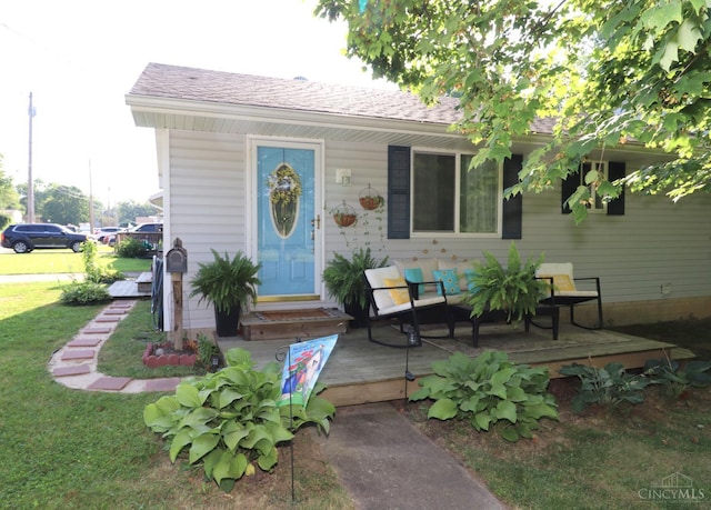 416 N Broadway St, Blanchester, OH 45107 - view of front of home featuring a deck, roof with shingles, and a front lawn
