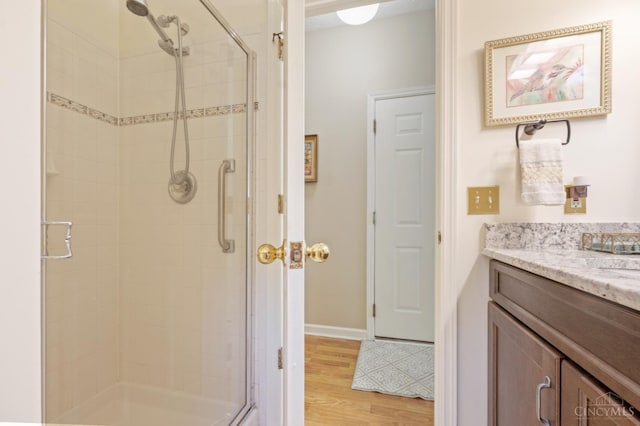 6911 Cozaddale Rd, Goshen, OH 45122 - bathroom featuring a stall shower, wood finished floors, and vanity