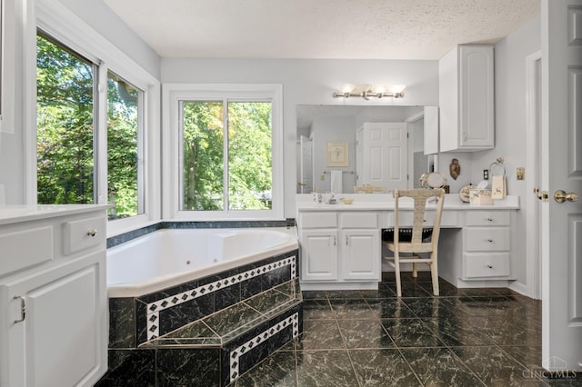 6911 Cozaddale Rd, Goshen, OH 45122 - full bathroom with vanity, a tub with jets, and marble finish flooring