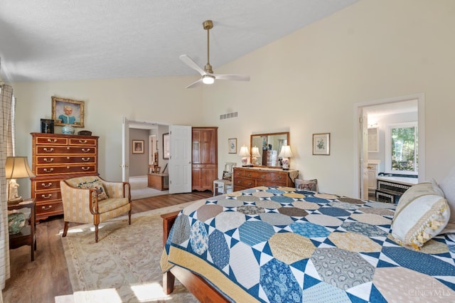6911 Cozaddale Rd, Goshen, OH 45122 - bedroom featuring wood finished floors and high vaulted ceiling