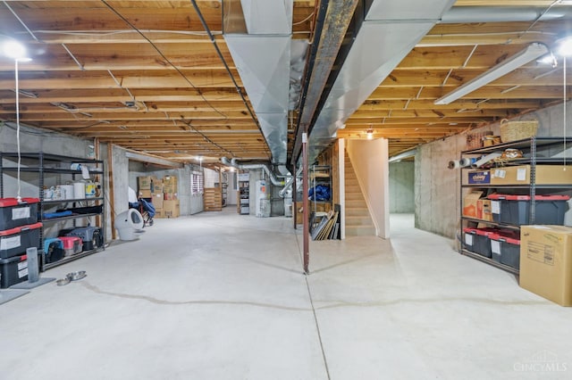 6911 Cozaddale Rd, Goshen, OH 45122 - unfinished below grade area featuring stairway and water heater
