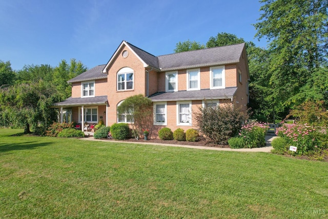 6911 Cozaddale Rd, Goshen, OH 45122 - view of front of house with a front yard, covered porch, and brick siding