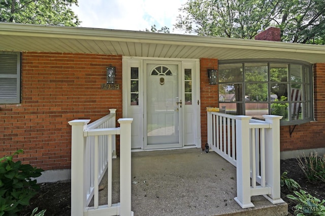 5428 Tallawanda Dr, Fairfield, OH 45014 - entrance to property featuring brick siding, a porch, and a chimney
