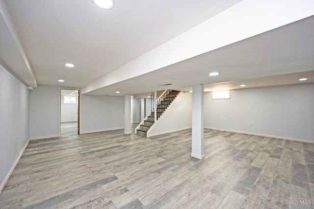 5428 Tallawanda Dr, Fairfield, OH 45014 - below grade area featuring stairway, recessed lighting, and wood finished floors