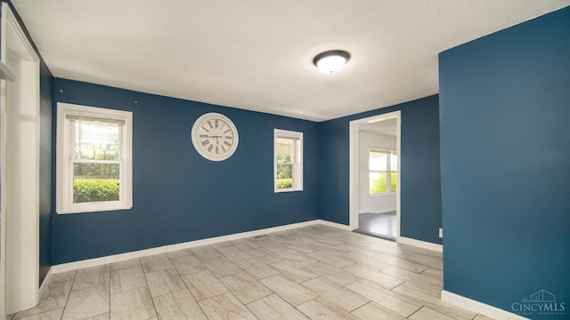 2662 Spring St, Bethel, OH 45106 - empty room with baseboards and a textured ceiling