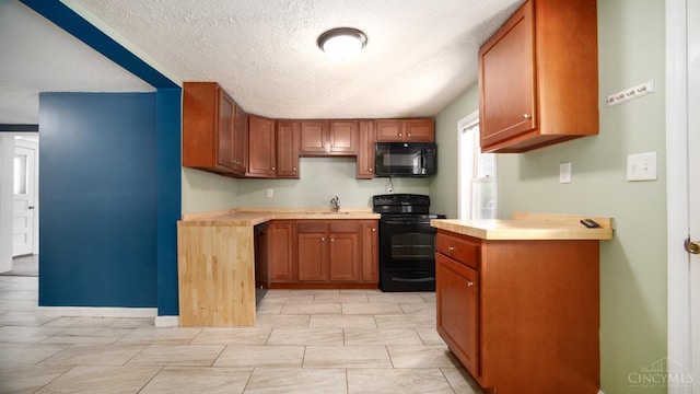 2662 Spring St, Bethel, OH 45106 - kitchen featuring black appliances, light countertops, a textured ceiling, and brown cabinets