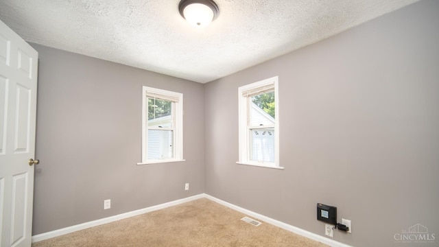 2662 Spring St, Bethel, OH 45106 - carpeted spare room featuring a textured ceiling and baseboards