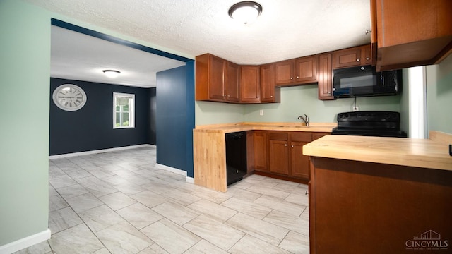 2662 Spring St, Bethel, OH 45106 - kitchen featuring black appliances, butcher block counters, brown cabinetry, and a textured ceiling