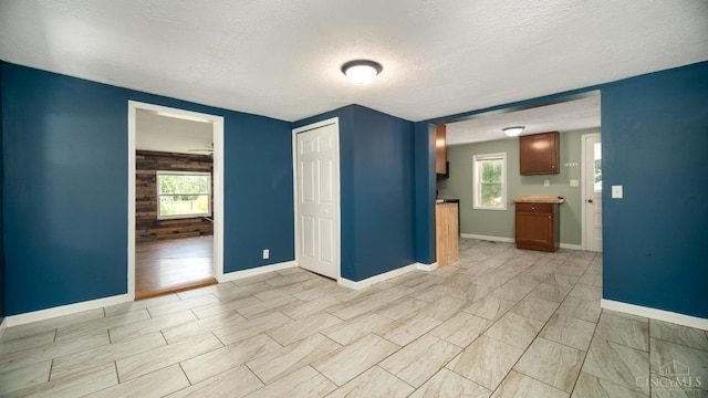 2662 Spring St, Bethel, OH 45106 - empty room with a textured ceiling and healthy amount of natural light