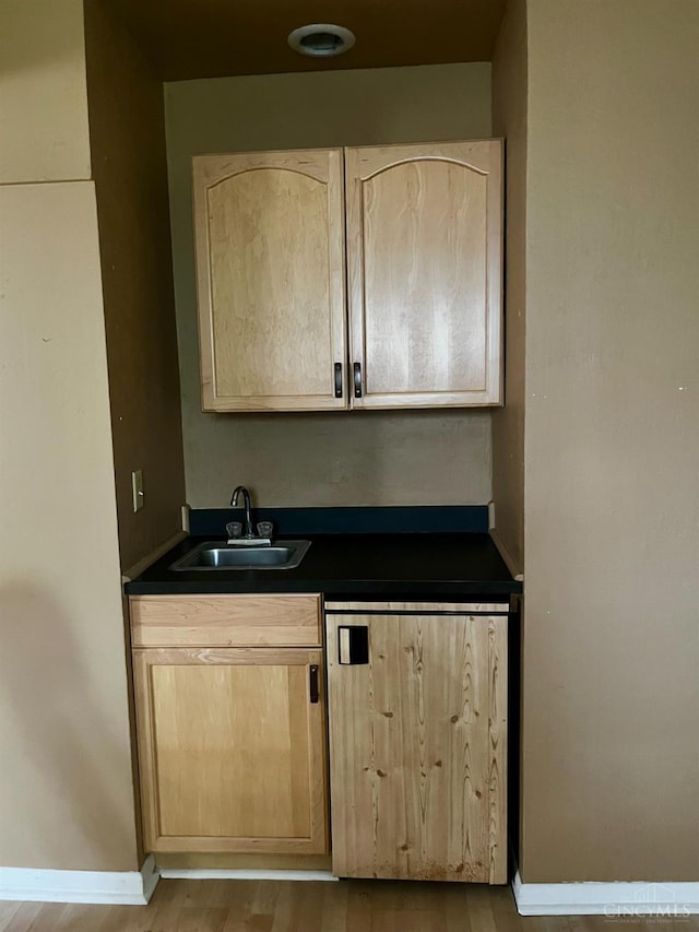 5674 Windsong Ln, Milford, OH 45150 - bar with a sink and wood finished floors