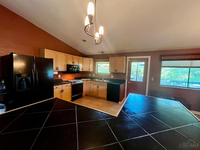 5674 Windsong Ln, Milford, OH 45150 - kitchen featuring black appliances, vaulted ceiling, light brown cabinetry, light tile patterned floors, and a chandelier