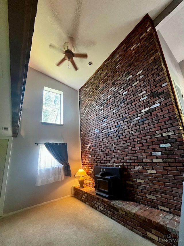 5674 Windsong Ln, Milford, OH 45150 - carpeted living room featuring a wood stove and a ceiling fan
