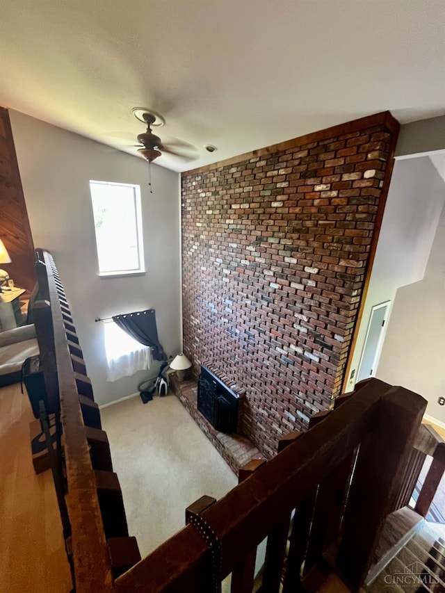 5674 Windsong Ln, Milford, OH 45150 - living area with ceiling fan and brick wall