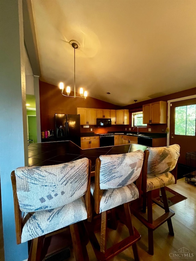 5674 Windsong Ln, Milford, OH 45150 - dining room with lofted ceiling and healthy amount of natural light