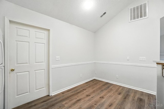 1300 Muirfield, Miami Twp, OH 45150 - spare room featuring vaulted ceiling and dark wood-type flooring