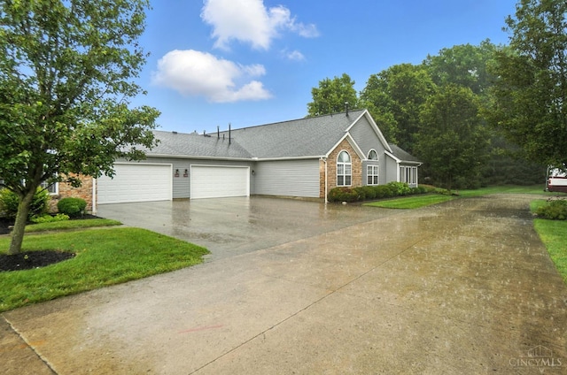 1300 Muirfield, Miami Twp, OH 45150 - view of home's exterior with driveway, an attached garage, roof with shingles, and a lawn