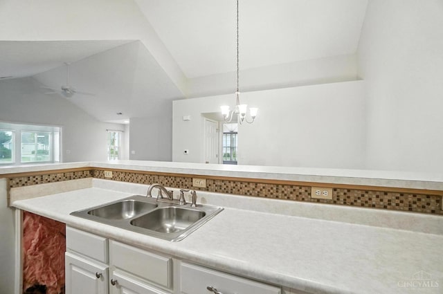 1300 Muirfield, Miami Twp, OH 45150 - kitchen featuring white cabinets, light countertops, ceiling fan, lofted ceiling, and a chandelier