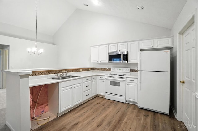 1300 Muirfield, Miami Twp, OH 45150 - kitchen with white appliances, a peninsula, white cabinets, decorative light fixtures, and high vaulted ceiling