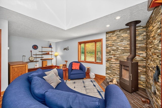 10869 Sand Run Rd, Whitewater Twp, OH 45030 - living area featuring a textured ceiling, wood finished floors, and a wood stove