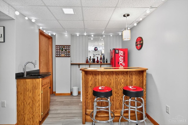 10869 Sand Run Rd, Whitewater Twp, OH 45030 - indoor bar featuring a paneled ceiling, light wood-type flooring, and hanging light fixtures