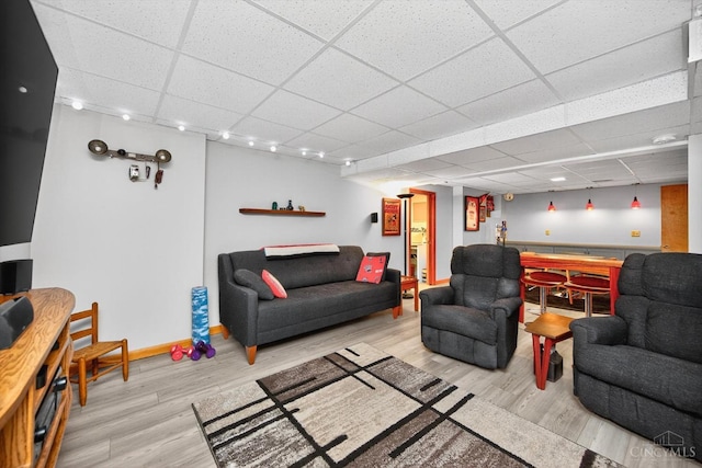 10869 Sand Run Rd, Whitewater Twp, OH 45030 - living area with a drop ceiling, wood finished floors, and bar area