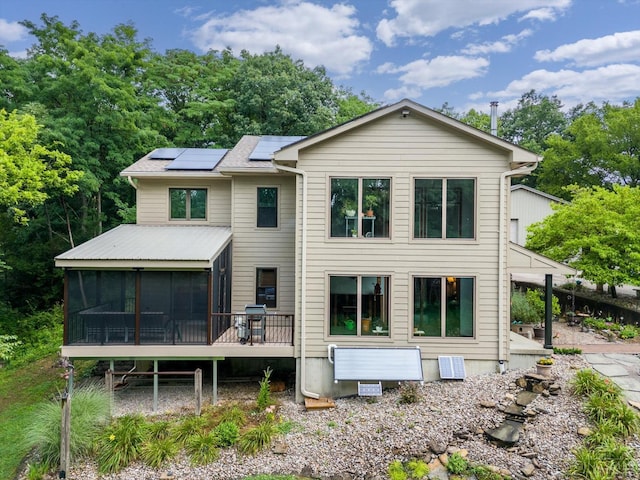 10869 Sand Run Rd, Whitewater Twp, OH 45030 - back of property featuring solar panels, a sunroom, and roof with shingles