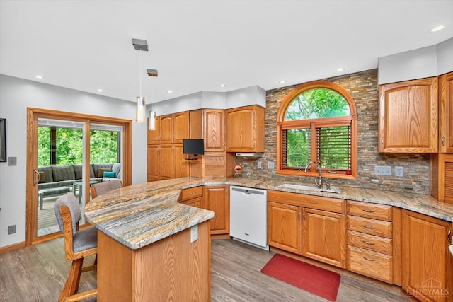 10869 Sand Run Rd, Whitewater Twp, OH 45030 - kitchen with a peninsula, plenty of natural light, light wood-style floors, and recessed lighting