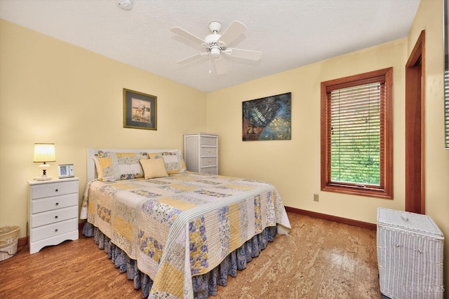 10869 Sand Run Rd, Whitewater Twp, OH 45030 - bedroom with wood finished floors and a ceiling fan