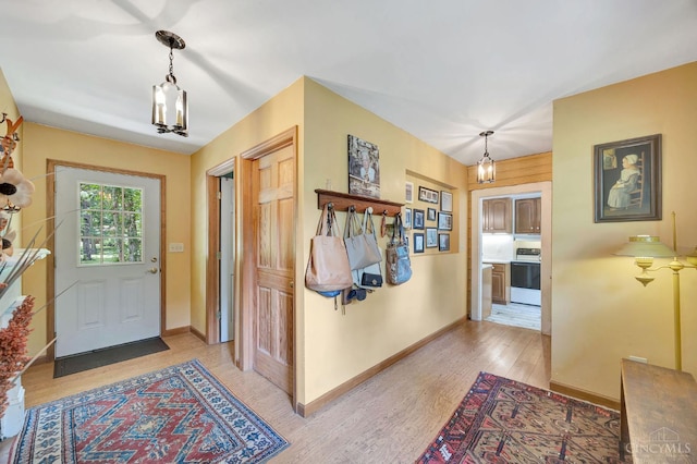 799 Millville Oxford Rd, Hamilton, OH 45013 - foyer featuring light wood-style floors and a chandelier